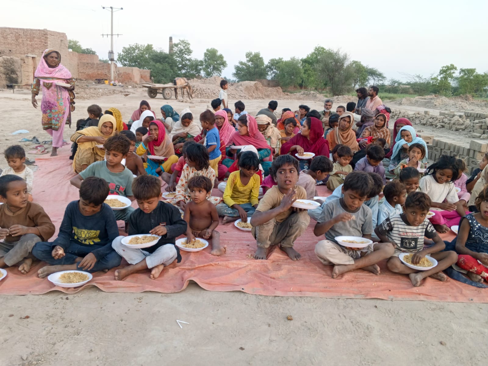 Christian children in a Pakistani village sharing a meal provided by SiC Ministry
